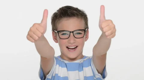 Expressive caucasian boy showing in the camera the thumbs up Stock Footage 41771809