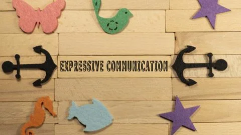 Expressive communication written on a wood-patterned surface. Education and c Stock Photos