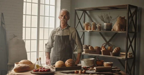 Expressive elderly caucasian moustached man working as a experienced baker at Stock-Footage 133123394