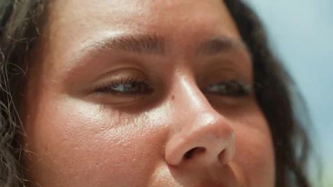 Expressive eyes and nose in warm outdoor island setting. Detailed portrayal of Stock Footage 338082370