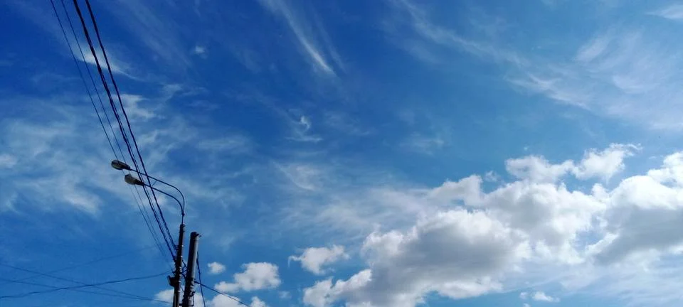 Expressive feather clouds Stock Photos
