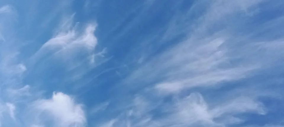 Expressive feather clouds Stock Photos