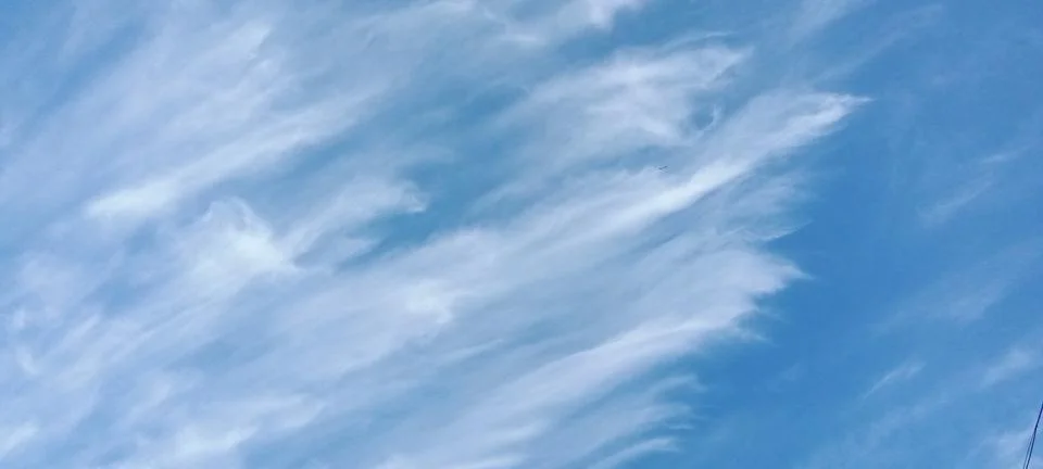 Expressive feather clouds Stock Photos