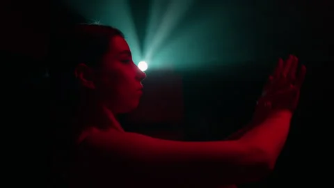 Expressive female dancer performs contemporary dance with classic ballet element Stock Footage 242911720