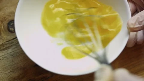 Expressive flour sprinkled over spinach and cheese mixture in soft focus, 4K Stock Footage 341110515
