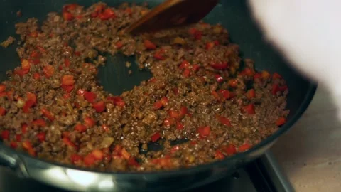Expressive fresh tomato salsa blended with herbs and garlic in warm light, 4K Stock Footage 341104647