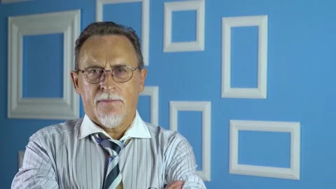 Expressive good looking senior man against bright wall. Stock Footage 134927465