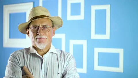 Expressive good looking senior man against bright wall. Stock Footage 134929884