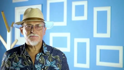  Expressive good looking senior man against bright wall at home Stock Footage 134932799