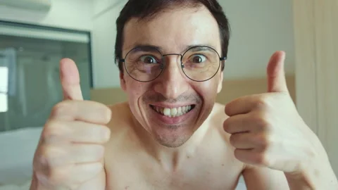 Expressive happy man showing thumbs up gesture Stock Footage 337365461