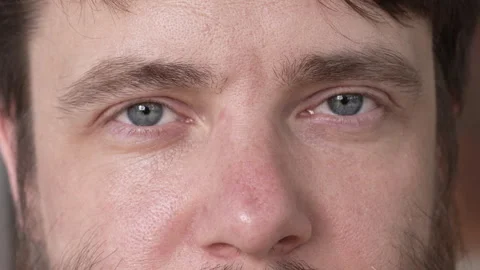 The expressive look of a bearded man with blue eyes. Close-up. Stock Footage 279983774