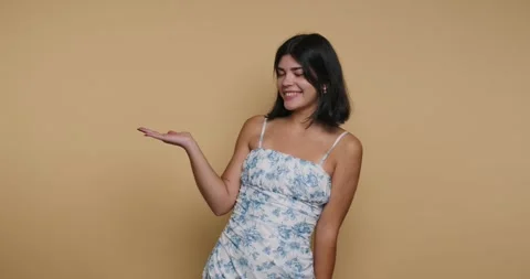 Expressive moments captured in a charming studio with a vibrant yellow back.. 動画素材 329109742