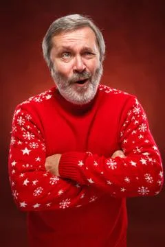 The expressive portrait on red background of a pouter man Stock Photos