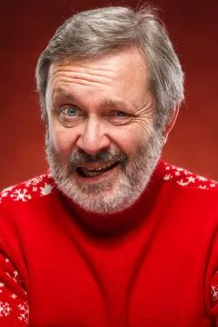 The expressive portrait on red background of a pouter man Stock Photos