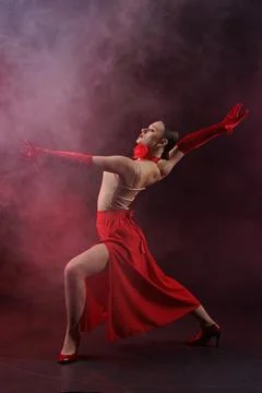 Expressive Solo Dancer Performing Dramatic Studio Pose with Red Costume Stock Photos