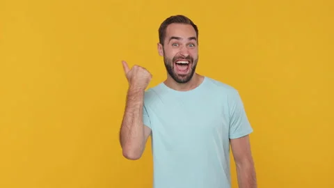 Expressive young man 20s years old in basic casual blue t-shirt look camera Stock Footage 148289267