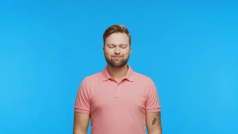 Expressive young man having pain over vibrant background. Studio portrait of Stock Footage 123545377