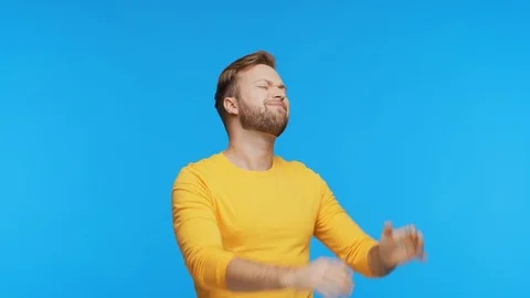 Expressive young man having pain over vibrant background. Studio portrait of Stock Footage 123545489