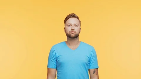 Expressive young man over vibrant background. Studio portrait of handsome person Stock Footage 123545759