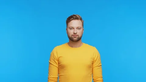 Expressive young man over vibrant background. Studio portrait of handsome person Stock Footage 123545885