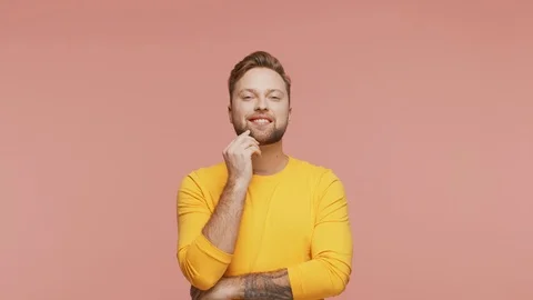 Expressive young man over vibrant background. Studio portrait of handsome person Stock Footage 123545932