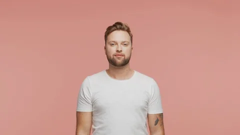 Expressive young man over vibrant background. Studio portrait of handsome person Stock Footage 123545967