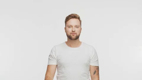 Expressive young man over vibrant background. Studio portrait of handsome person Stock Footage 123546013