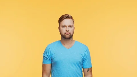 Expressive young man over vibrant background. Portrait of handsome person. Stock Footage 123703202