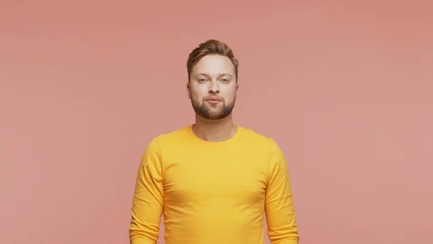 Expressive young man over vibrant background. Studio portrait of handsome person Stock Footage 123712914