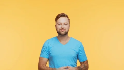 Expressive young man over vibrant background. Studio portrait of handsome person Stock Footage 123778493