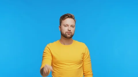 Expressive young man over vibrant background. Studio portrait of handsome person Stock Footage 123778551