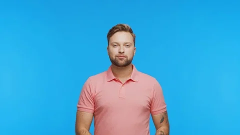 Expressive young man over vibrant background. Studio portrait of handsome person Stock Footage 123859077