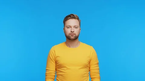 Expressive young man over vibrant background. Studio portrait of handsome person Stock Footage 123859126