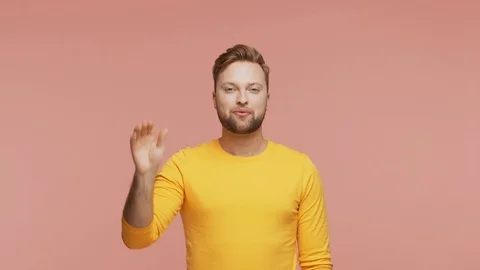 Expressive young man over vibrant background. Studio portrait of handsome person Stock Footage 123859167