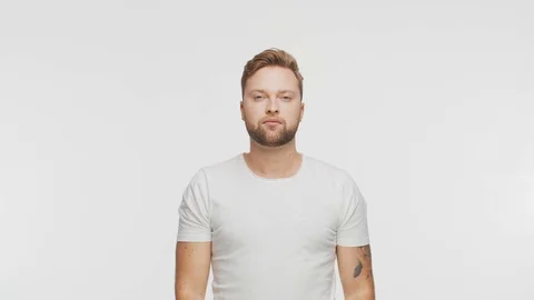 Expressive young man over vibrant background. Studio portrait of handsome person Stock Footage 123859190