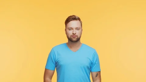 Expressive young man over vibrant background. Studio portrait of handsome person Stock Footage 123859465