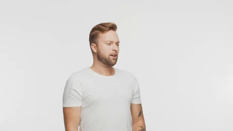 Expressive young man over vibrant background. Portrait of handsome person. Video stock 123995024