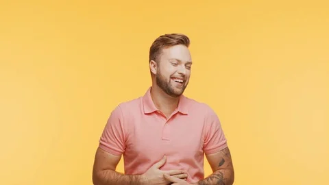 Expressive young man over vibrant background. Studio portrait of handsome person Stock Footage 125066203