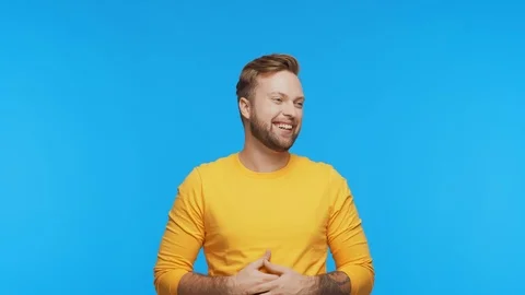 Expressive young man over vibrant background. Studio portrait of handsome person Stock Footage 125170713