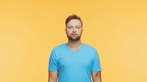 Expressive young man over vibrant background. Studio portrait of handsome person Stock Footage 125170727