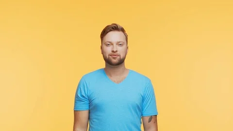 Expressive young man over vibrant background. Studio portrait of handsome person Stock Footage 125372793