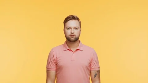Expressive young man over vibrant background. Studio portrait of handsome person Stock Footage 125510854