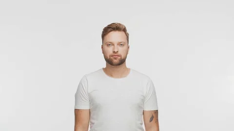 Expressive young man over vibrant background. Studio portrait of handsome person Stock Footage 125510877
