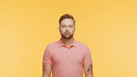 Expressive young man over vibrant background. Studio portrait of handsome person Video stock 125789764