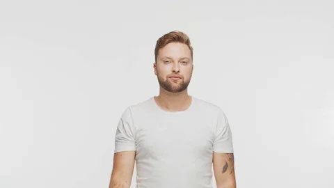 Expressive young man over vibrant background. Studio portrait of handsome person Stock Footage 125789780