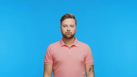 Expressive young man over vibrant background. Studio portrait of handsome person Video stock 125789919