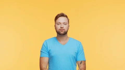 Expressive young man over vibrant background. Studio portrait of handsome person Stock Footage 125934739