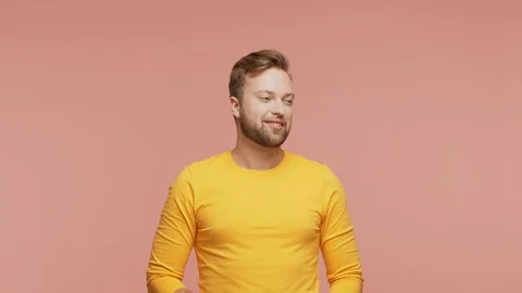 Expressive young man over vibrant background. Studio portrait of handsome person Stock Footage 125934836