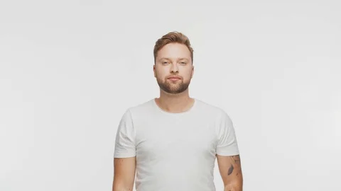 Expressive young man over vibrant background. Studio portrait of handsome person Stock Footage 125934858
