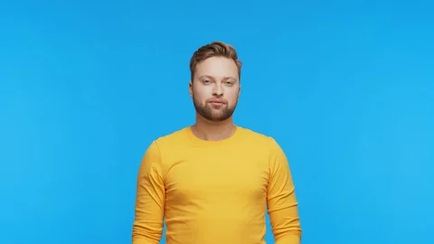Expressive young man over vibrant background. Studio portrait of handsome person Stock Footage 126244128